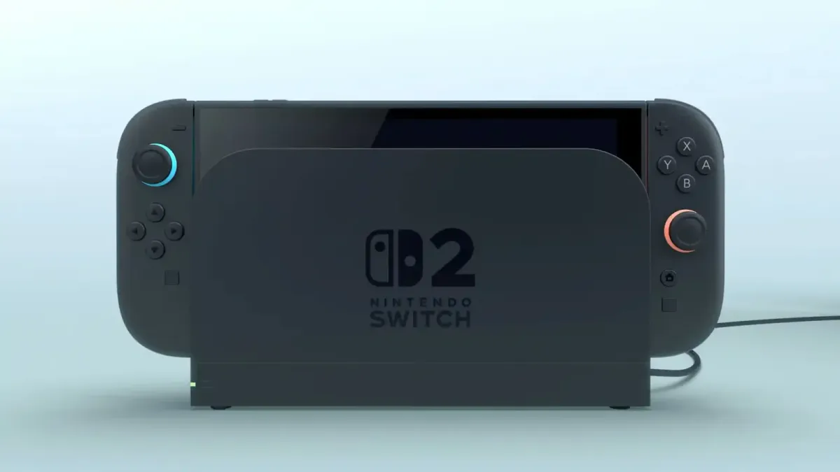 Nintendo Switch 2 vist i håndholdt tilstand og i dock mod en blå baggrund.